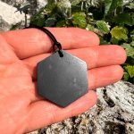 Shungite men's jewelry hexagon in the hand