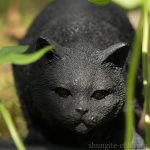 black cat walking statue