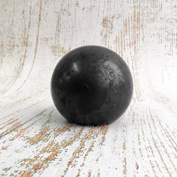 polished vs unpolished shungite surface of sphere